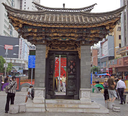 Kunming, China - June 8, 2015: landmark in the shape of gate on central square in Kunming, Chinaのeditorial素材