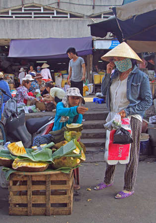 Hue, Vietnam - May 27, 2015: woman is selling jackfruits on street market in Hue, Vietnamのeditorial素材
