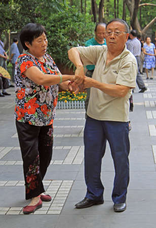 Chengdu, China - June 14, 2015: people are dancing in park of Chengdu, Chinaのeditorial素材