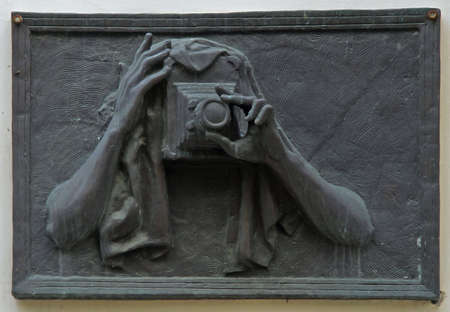 Chelyabinsk, Russia - July 22, 2015: sculpture of photographer on the wall of building in Chelyabinsk, Russiaのeditorial素材