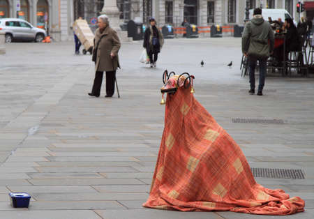 Trieste, Italy - November 20, 2015: street artist in the strange costume is entertaining passers nearly the central square in Trieste, Italyのeditorial素材