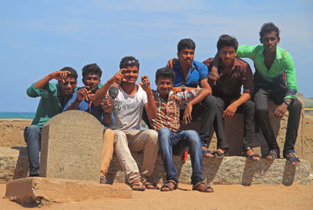 Kanyakumari, India - March 8, 2015: guys are sitting outdoor and enjoying fresh wind in Kanyakumari, Indiaのeditorial素材