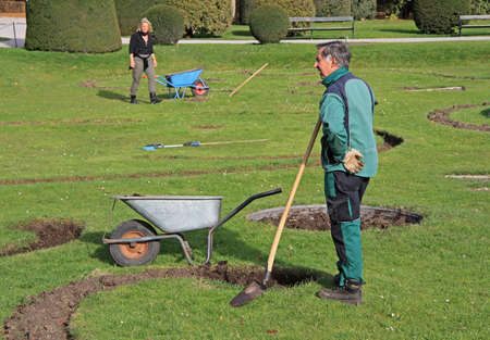 Vienna, Austria - November 10, 2015: garden workers are digging in park of Vienna, Austriaのeditorial素材