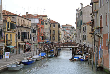 Venice, Italy - November 23, 2015: people are walking nearly the narrow water canal in Venice, Italyのeditorial素材