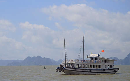 Ha Long bay, Vietnam - June 4, 2015: people are floating in ferry by Ha long bay on the north of Vietnamのeditorial素材