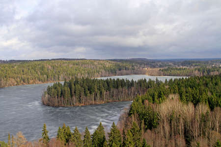 Frozen lake and forest view from the viewpointの写真素材