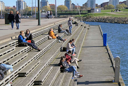 Malmo, Sweden - April 22, 2017: people are sitting and enjoying view of sea in Malmo, Swedenのeditorial素材
