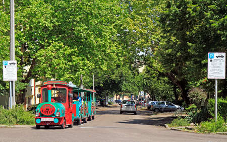 Eger, Hungary - July 2, 2017: Tourist train at old city street in Eger, Hungaryのeditorial素材