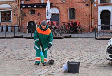 Kaunas, Lithuania - April 26, 2017: woman in uniform is working outdoor in Kaunas,のeditorial素材