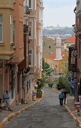 Istanbul, Turkey - August 9, 2017: people are walking by the narrow street in Istanbul, Turkeyのeditorial素材