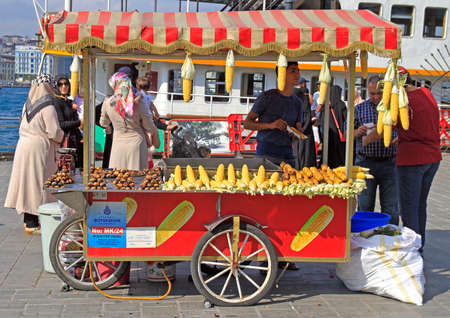 Istanbul, Turkey - August 11, 2017: man is selling fried corn and chestnut outdoor in Istanbul, Turkeyのeditorial素材