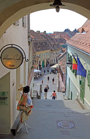 people are walking by the old town in Sibiu, Romaniaのeditorial素材