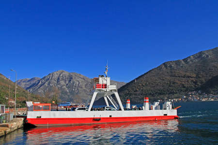 Kamenari, Montenegro - December 25, 2017: people are going to leave a ferry between 2 sides of Tivat bay, Montenegroのeditorial素材