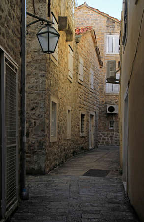 Picturesque narrow street in old town of Budva, Montenegroの写真素材