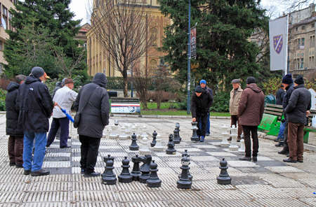 Sarajevo, Bosnia and Herzegovina - December 18, 2017: men are playing chess with huge figures outdoor in Sarajevo, Bosnia and Herzegovinaのeditorial素材