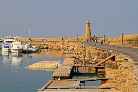 Kyrenia, Cyprus - November 18, 2017: people are walking by pier at historical Kyrenia harbour in North Cyprusのeditorial素材