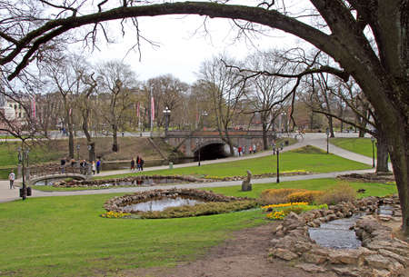 people are walking by Bastion hill and park in Riga, Latviaのeditorial素材