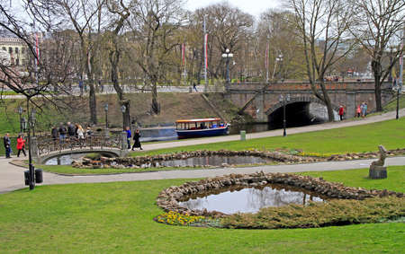 people are walking by Bastion hill and park in Riga, Latviaのeditorial素材
