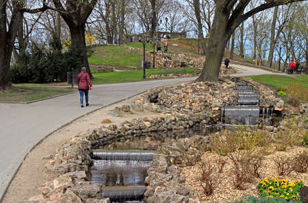 people are walking by Bastion hill and park in Riga, Latviaのeditorial素材