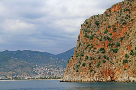 Seascape with Alanya's castle rock peninsula and mountains, Turkeyの写真素材