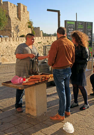 Jerusalem, Israel - December 3, 2017: boy is selling bread outdoor in the old city of Jerusalem, Israelのeditorial素材