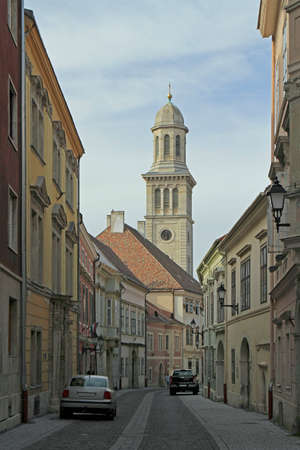 street with view of evangelical church in city Sopron, Hungaryの写真素材