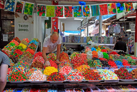 Tel Aviv, Israel - November 30, 2017: man sells oriental sweets at Carmel market in Tel-Aviv, Israelのeditorial素材