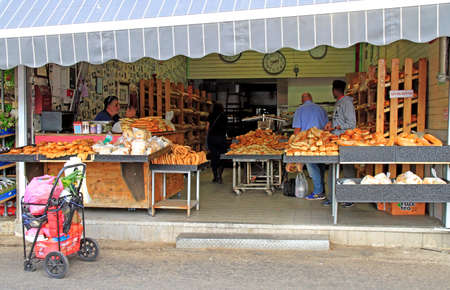 Tel Aviv, Israel - November 30, 2017: man sells bread at Carmel market in Tel Aviv, Israelのeditorial素材