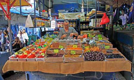 Tel Aviv, Israel - November 30, 2017: man sells seasonings at Carmel market in Tel-Aviv, Israelのeditorial素材