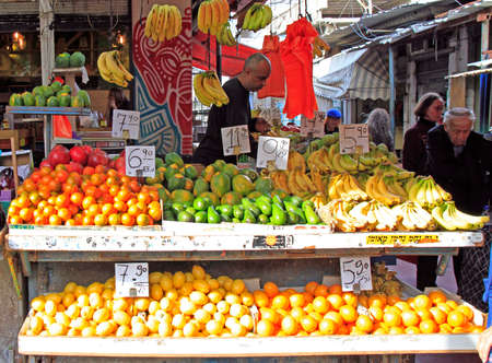 Tel Aviv, Israel - November 30, 2017: man sells fruits outdoors at Carmel market in Tel Aviv, Israelのeditorial素材