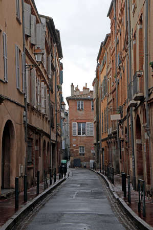 the narrow street in the french city Toulouseの写真素材