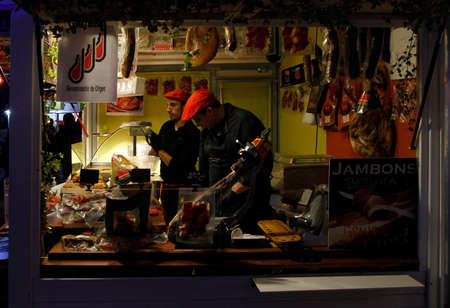 Toulouse, France - December 4, 2018: men are selling food at outdoor christmas market in Toulouse, Franceのeditorial素材