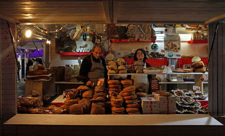 Toulouse, France - December 4, 2018: man and woman are selling at outdoor christmas market in Toulouse, Franceのeditorial素材