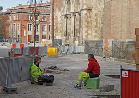 Toulouse, France - December 4, 2018: street workers are taking a minute of rest outdoors in Toulouse, Franceのeditorial素材