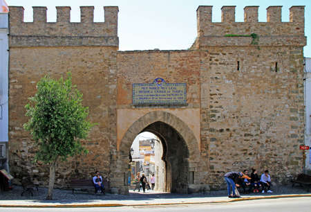 Tarifa, Spain - May 7, 2018: people are sitting at the Jerez Gate of the old town in spanish city Tarifaのeditorial素材