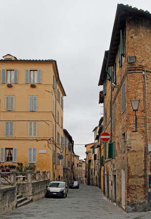 the narrow street in old town of italian city Sienaの写真素材