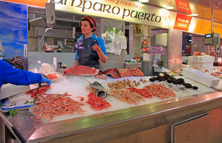 Valencia, Spain - April 26, 2018: women are selling seafood at central market in Valencia, Spainのeditorial素材