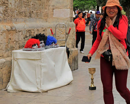 Valencia, Spain - April 25, 2018: chinese tourist laughs at street performers in Valencia, Spainのeditorial素材