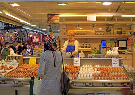 Valencia, Spain - April 26, 2018: man is selling eggs at central market in Valencia, Spainのeditorial素材