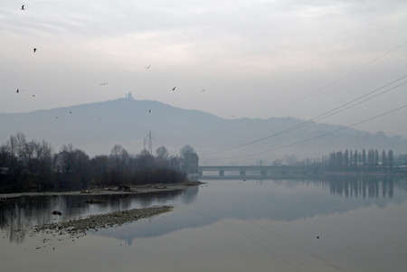 View of Basilica of the Superga from the embankment of the River Dora Riparia in Turinの写真素材
