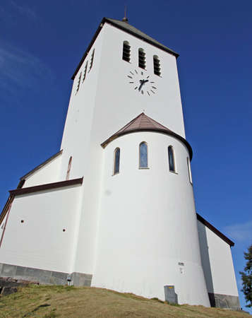 the white church with clock in Svolvaerの写真素材