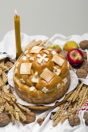 Orthodox Serbian religious cake with apple and candleの写真素材
