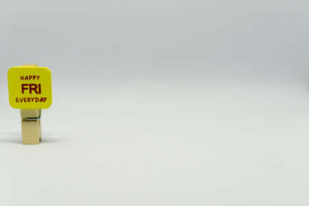 Happy Friday - cute daily planning wooden clip with white backgroundの写真素材