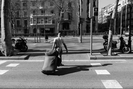 BARCELONA,SPAIN - February 26,2017: Shot of Plaça de Catalunya street  in Barcelona, Spain. This image may contain noise ,blurry clouds due to long exposure, soft focus and poor lighting.のeditorial素材