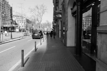 BARCELONA,SPAIN - February 26,2017: Shot of Plaça de Catalunya street  in Barcelona, Spain. This image may contain noise ,blurry clouds due to long exposure, soft focus and poor lighting.のeditorial素材