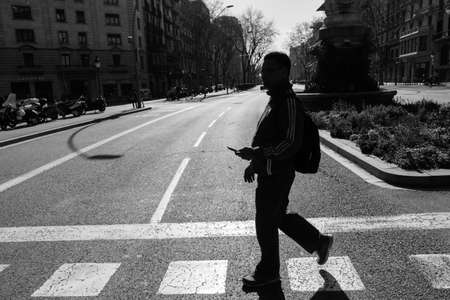 BARCELONA,SPAIN - February 26,2017: Shot of Plaça de Catalunya street  in Barcelona, Spain. This image may contain noise ,blurry clouds due to long exposure, soft focus and poor lighting.のeditorial素材