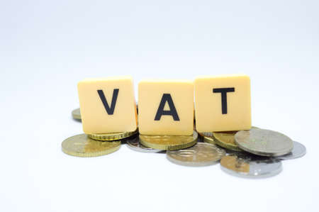 Finance Concept with Stack of Coins - VAT (Value Added Tax ) written on.の写真素材