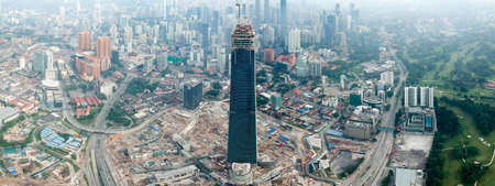 KUALA LUMPUR, MALAYSIA - 24 May 2018: Beautiful and dramatic aerial view of Kuala Lumpur city with new skyscraper under construction in Tun Razak Exchange.のeditorial素材