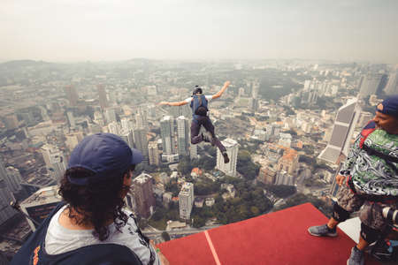Kuala Lumpur, Malaysia â€“ September 28, 2018: Base Jumpers jump from a 300m high deck during...