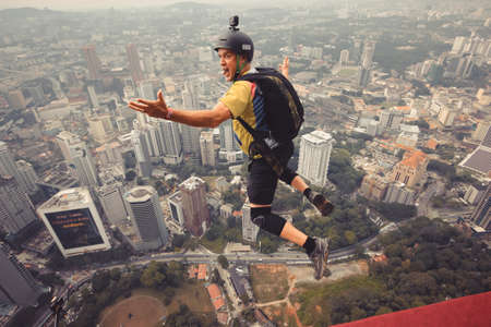 Kuala Lumpur, Malaysia â€“ September 28, 2018: Base Jumpers jump from a 300m high deck during...